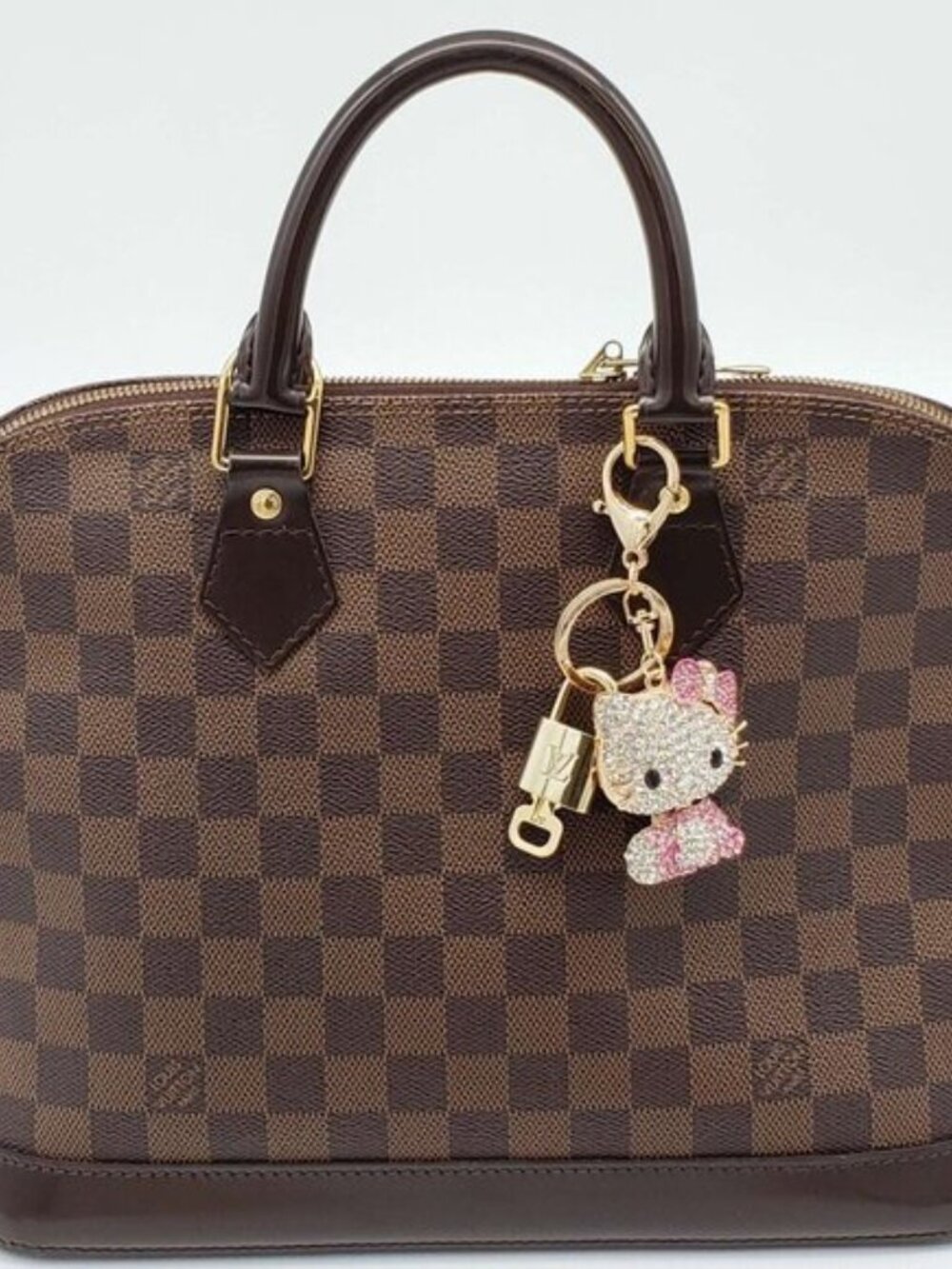 Louis Vuitton Gold Lock 🔒 Authentic LV Key + Unbranded Hello Kitty Bag Charm - Picture 3 of 8